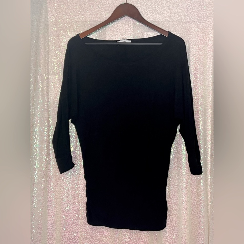 Black dolman top with ruched sides.